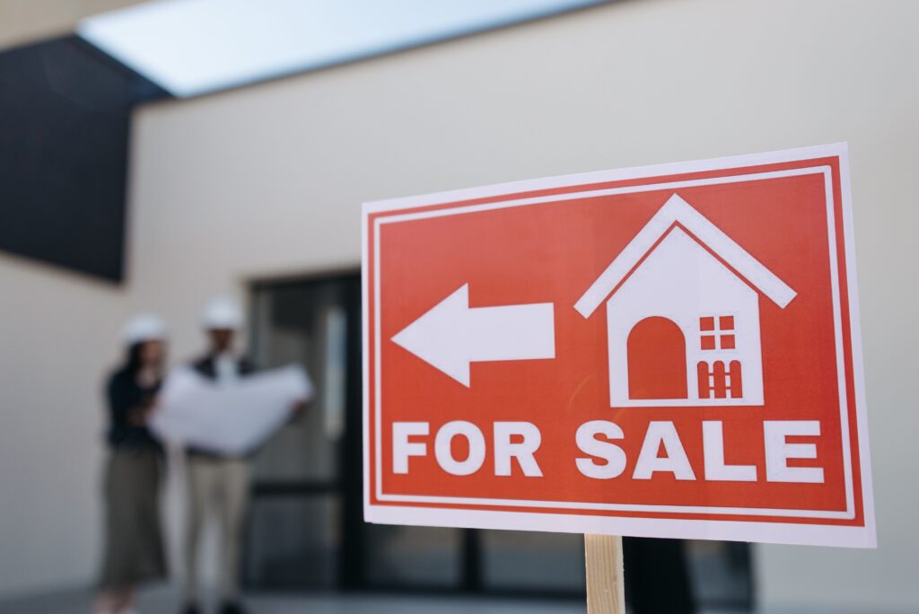 For Sale sign outside of commercial building