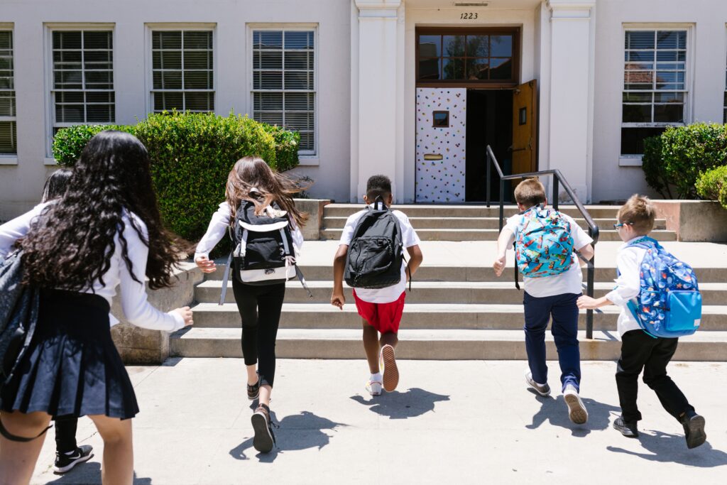 Children entering a school building